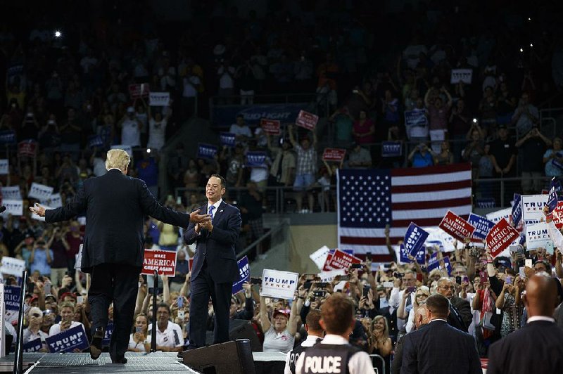 Republican National Committee Chairman Reince Priebus greets presidential candidate Donald Trump during a campaign rally Friday in Erie, Pa.