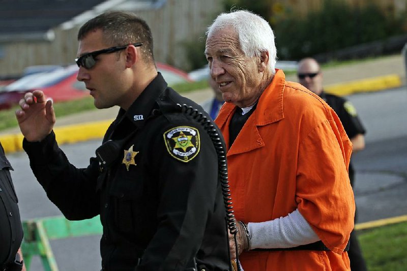 Former Pennsylvania State University assistant football coach Jerry Sandusky (right) arrives for his appeals hearing Friday in Bellefonte, Pa.
