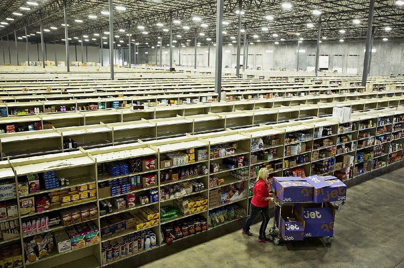 An employee assembles customer orders at the Jet.com Inc. fulfillment center on Cyber Monday in Kansas City, Kansas, in November. 