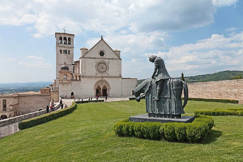The Basilica of St. Francis rises from a ridge at the lower end of Assisi’s old town. 