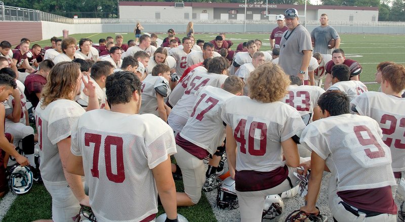 Graham Thomas/Siloam Sunday Siloam Springs head coach Bryan Ross talks to the Panthers after wrapping up practice on Friday morning at Panther Stadium.
