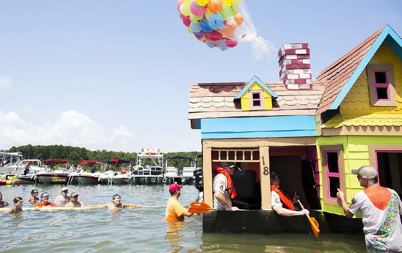 Coated in glue and varnish, Green Bay Packaging’s boat is 12 feet tall, 9 feet long, 10 feet wide and weighs more than 300 pounds. The bottom is double-layered, the walls are single-layered, and 125 balloons float above the roof.