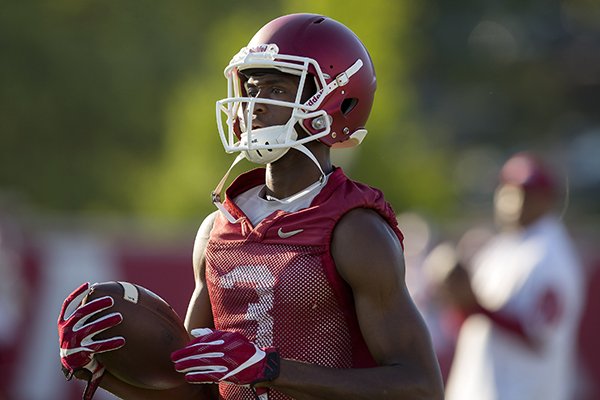 Arkansas receiver Dominique Reed goes through practice Thursday, Aug. 4, 2016, in Fayetteville. 