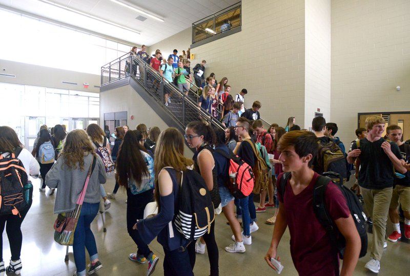 Students begin a scavenger hunt throughout the school on Monday Aug. 15, 2016 during the first day of school at Bentonville West High School in Centerton.