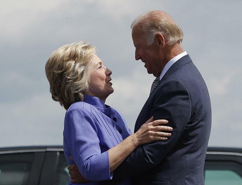 Hillary Clinton greets Vice President Joe Biden on Monday on the tarmac at Wilkes-Barre/Scranton International Airport in Avoca, Pa.