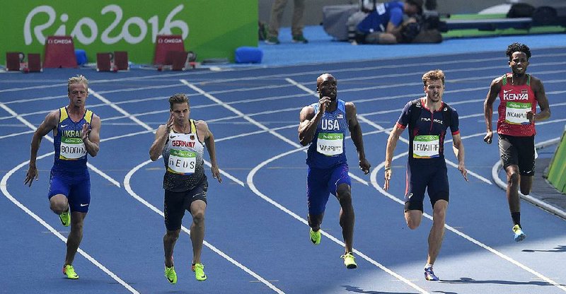From left, Ukraine's Ihor Bodrov, Germany's Julian Reus, United States' Lashawn Merritt, France's Christophe Lemaitre and Carvin Nkanata of Kenya compete in a men's 200-meter heat during the athletics competitions of the 2016 Summer Olympics at the Olympic stadium in Rio de Janeiro, Brazil, Tuesday, Aug. 16, 2016. 