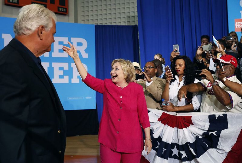 Rep. Robert Brady, D-Pa., accompanies Hillary Clinton at a Democratic Party voter-registration event Tuesday at West Philadelphia High School. 
