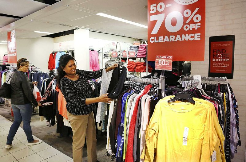 Shoppers look at sale items at a J.C. Penney store in New York in this file photo. 
