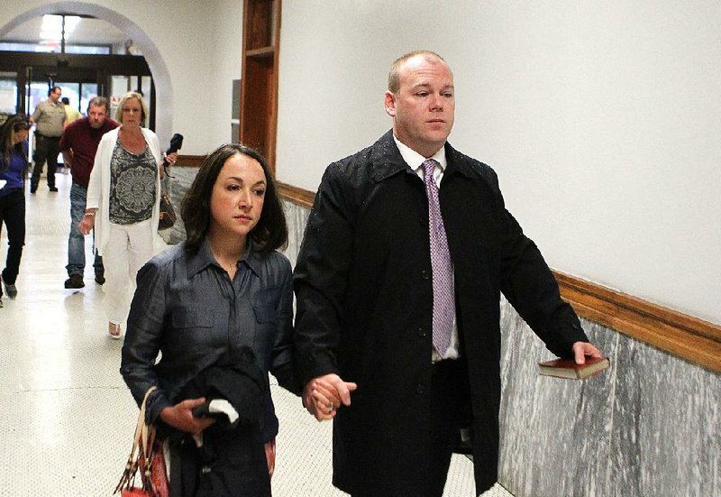 Judge Wade Naramore, right, walks into the Garland County Courthouse with his wife Ashley Naramore Monday, August 15, 2016. 