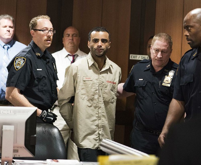 Oscar Morel, who faces murder charges in the shooting deaths of an imam and another man, makes a court appearance Tuesday in the Queens borough of New York.