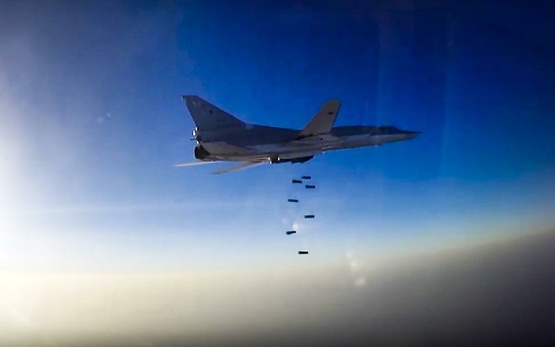 A Russian Tu-22M3 long-range bomber conducts an airstrike Tuesday over the Aleppo region of Syria in this frame grab provided by the Russian Defense Ministry’s news service.