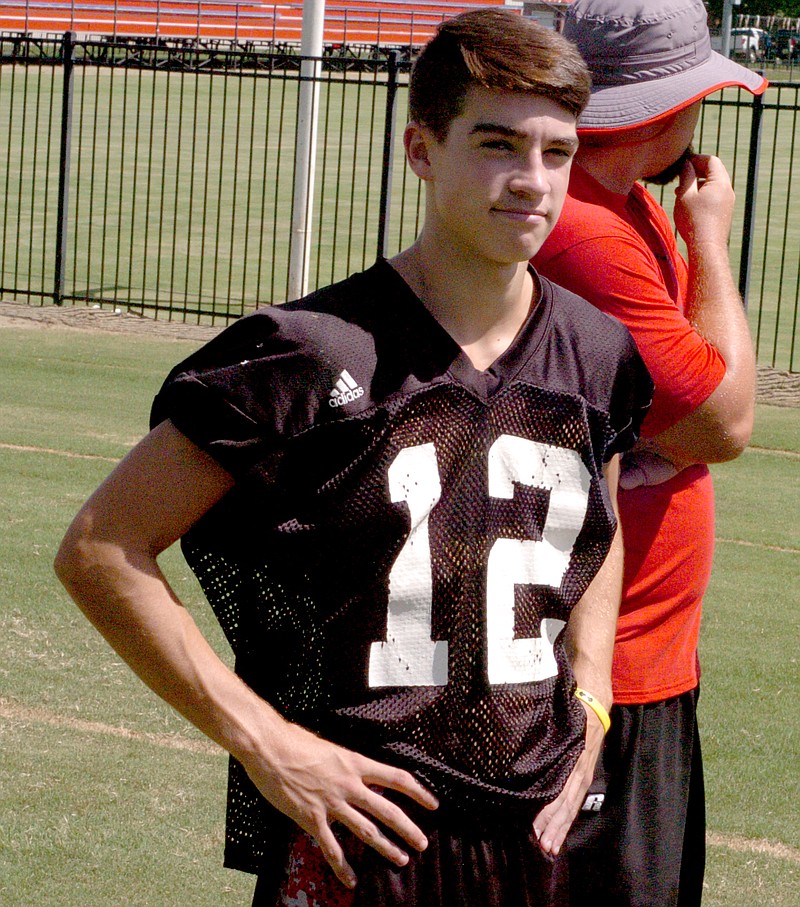 MARK HUMPHREY ENTERPRISE-LEADER Farmington junior Trey Waggle, shown in a recent practice, is competing for the starting quarterback job with senior Jake Oskey. Each led an offense during Tuesday&#8217;s Red and White game to kick off the Farmington football season.