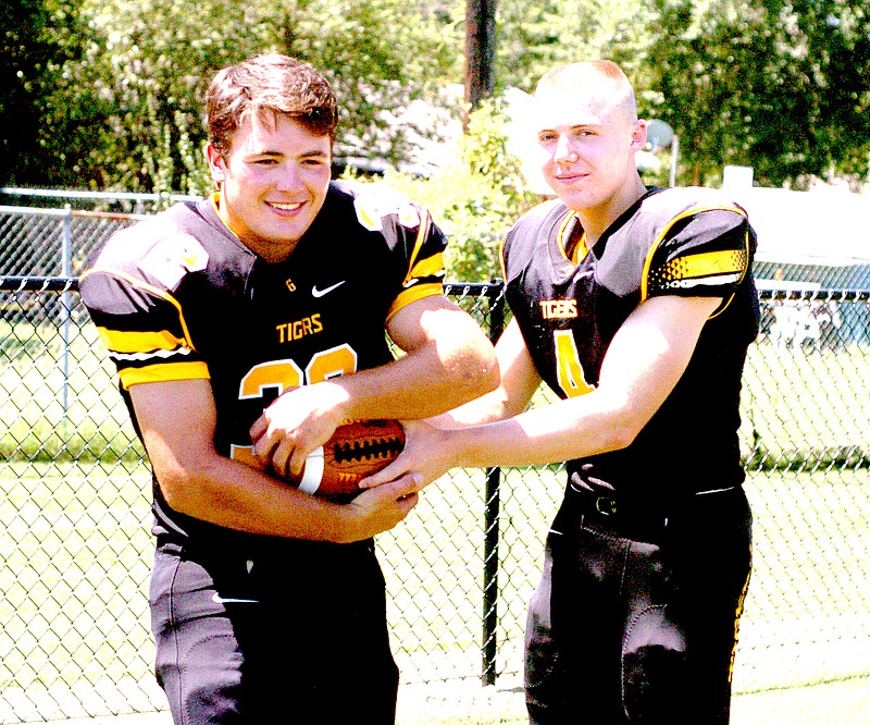 MARK HUMPHREY ENTERPRISE-LEADER Prairie Grove seniors, fullback Reed Orr (left) and quarterback Zeke Laird, figure to play major roles in the Tiger offense. Prairie Grove will host their annual Black and Gold game Thursday at 6:30 p.m. to start the football season.