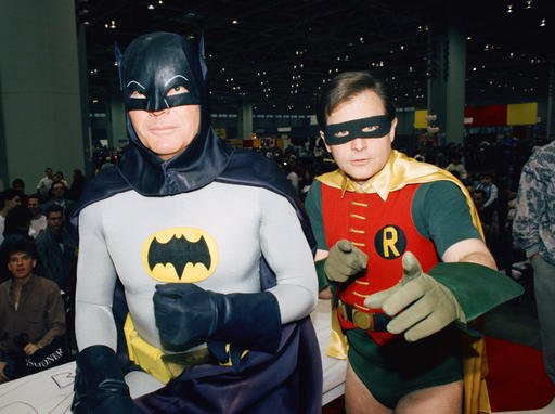 In this Jan. 27, 1989, file photo, actors Adam West, left, and Burt Ward dress as their characters Batman and Robin respectively during an appearance at the "World of Wheels" custom car show in Chicago.