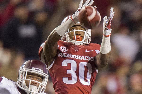 Arkansas defensive back Kevin Richardson breaks up a pass intended for Mississippi State wide receiver Donald Gray on Saturday, Nov. 21, 2015, at Donald W. Reynolds Razorback Stadium in Fayetteville.