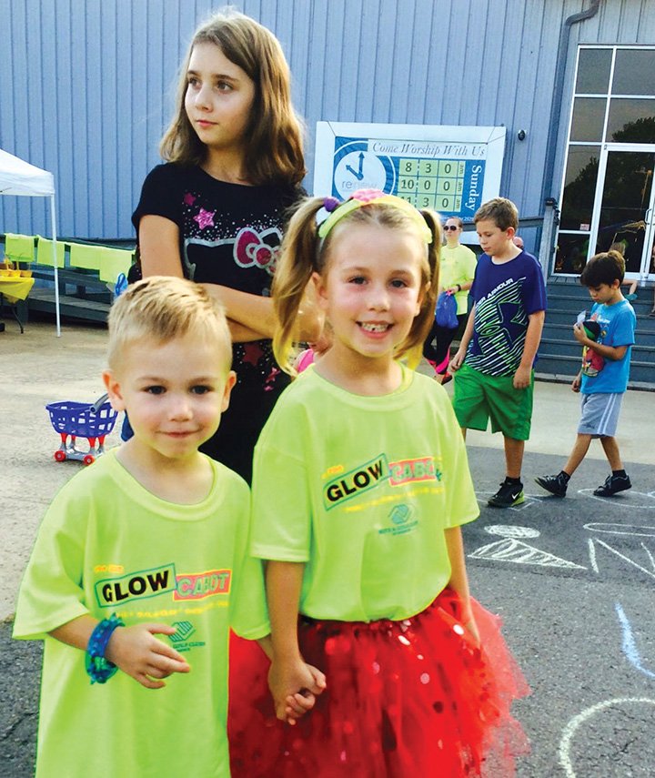 Bentley and Madison Hardin hold hands during the Future Boys & Girls Club’s 2015 Glow Cabot 5K. The glow-in-the-dark run/walk, which will return Aug. 26, raises money for the nonprofit to apply for its charter and eventually open a location.