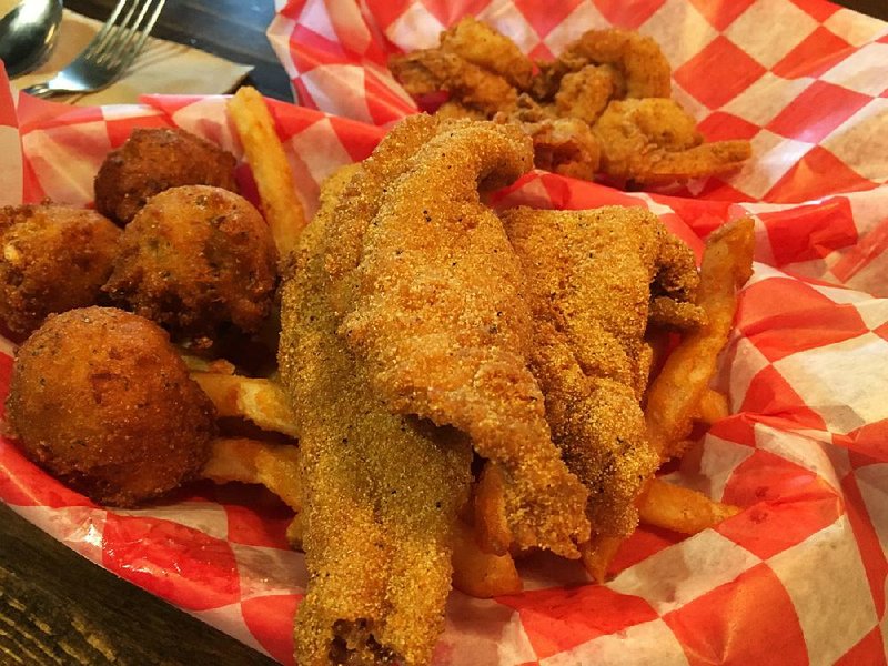 The Catfish-Shrimp Combo (with extra hush puppies on the side) came in separate baskets at the Little Rock branch of Eat My Catfish in Breckenridge Village.