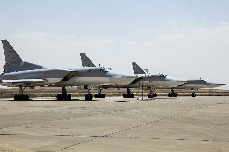 Three Russian Tu-22M3 bombers stand on the tarmac Monday at an Iranian air base near Hamedan. 