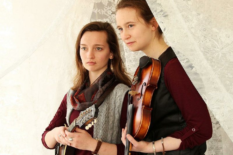 The Vogt Sisters — Abigail (left, acoustic guitar and lead vocals) and Maggie (fiddle and harmony vocals) — perform Saturday at the Ozark Folk Center in Mountain View.

