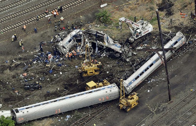 Emergency personnel work at the scene of an Amtrak train derailment in Philadelphia in this May 2015 file photo.