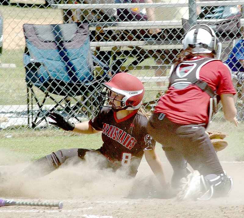 Photo by Rick Peck McDonald County&#8217;s Cloee Helm scores the tying run in the Lady Mustangs 8-7 win over Nevada in a scrimmage on Saturday at MCHS. Helm scored the run all the way from second on a sacrifice bunt by Hanna Schmit.