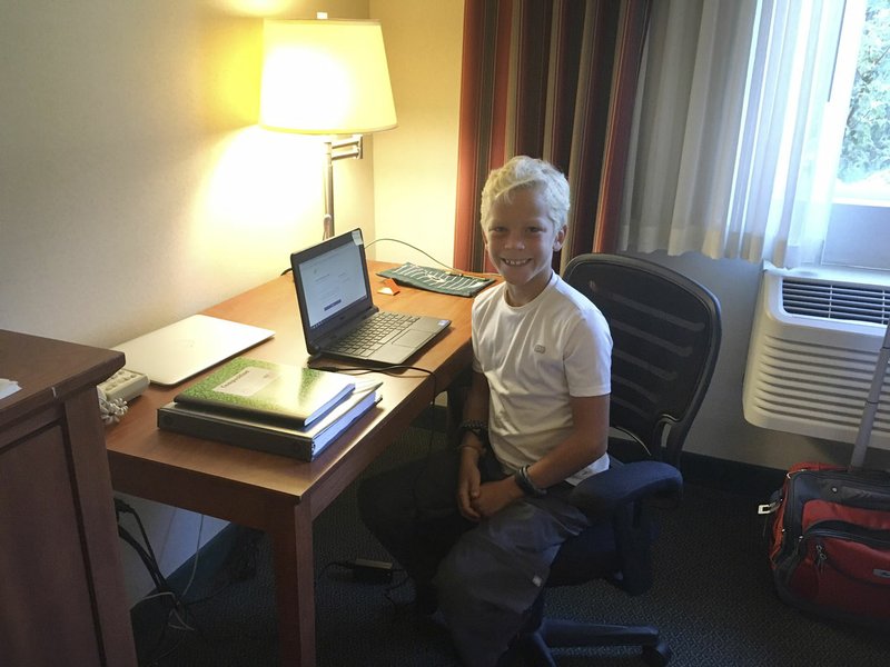 Daxton Tessmer, 10, begins his first day as a fourth-grader in the Fayetteville Virtual Academy from a hotel room in Bellingham, Wash., where his family is spending a few days before beginning a journey through Alaska.