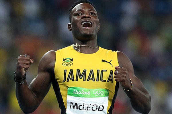 Jamaica's Omar McLeod celebrates winning gold in the men's 110-meter hurdles final, during the athletics competitions in the Olympic stadium of the 2016 Summer Olympics in Rio de Janeiro, Brazil, Tuesday, Aug. 16, 2016. (AP Photo/Lee Jin-man)