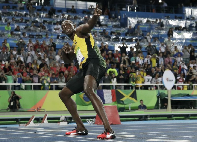 Jamaica’s Usain Bolt poses after capturing his second gold medal of the Rio Games by winning the 200-meter final Thursday night. Bolt’s time of 19.78 seconds was far too much for silver medalist Andre De Grasse, of Canada, or bronze medalist Christopher Lemaitre, of France, to overcome. Bolt, 29, now has won the 100 and 200 in three consecutive Olympics.