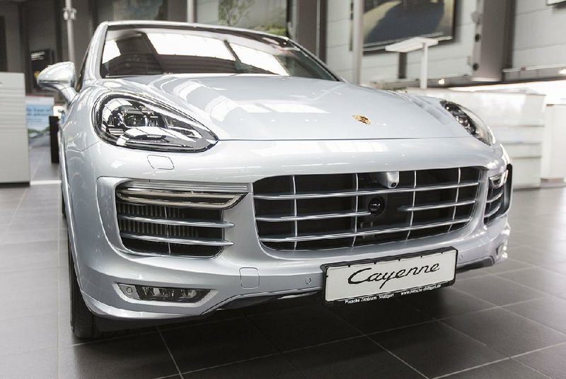 A Porsche Cayenne GTS luxury automobile sits on display inside a Porsche AG showroom in Stuttgart, Germany, in March.