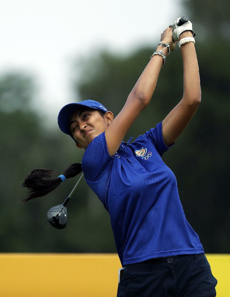 Indian golfer Aditi Ashok tees off on the 3rd hole during Thursday’s round in Rio de Janeiro.