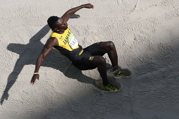 Jamaica's Clive Pullen lands during a qualifying round of the triple jump during the athletics competitions of the 2016 Summer Olympics at the Olympic stadium in Rio de Janeiro, Brazil, Monday, Aug. 15, 2016. (AP Photo/Morry Gash)

