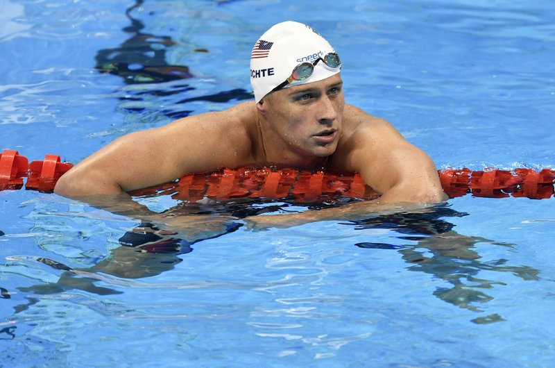 FILE - In this Aug. 9, 2016, file photo, United States' Ryan Lochte checks his time after a men' 4x200-meter freestyle relay heat during the swimming competitions at the 2016 Summer Olympics in Rio de Janeiro, Brazil. A Brazilian police official told The Associated Press that Lochte fabricated a story about being robbed at gunpoint in Rio de Janeiro. (AP Photo/Martin Meissner, File)
