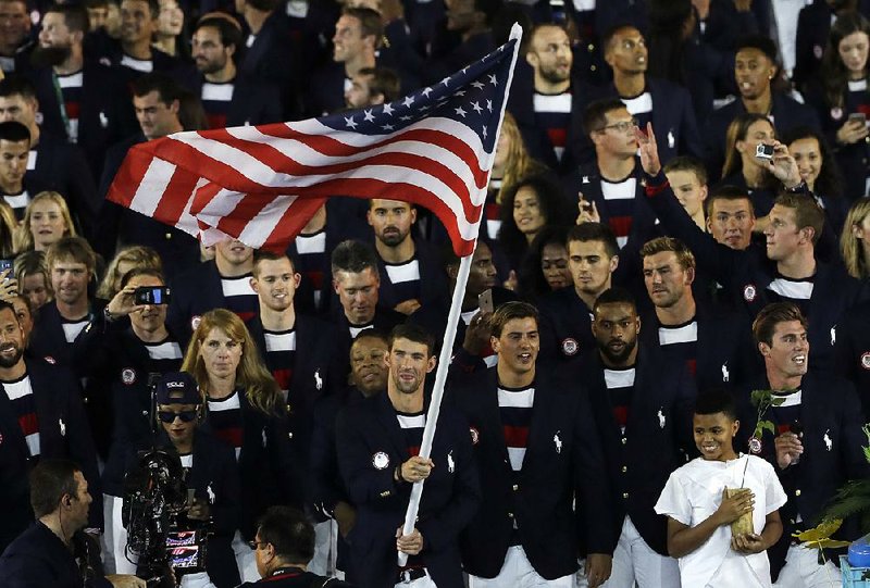 Michael Phelps was given the honor of carrying the American fl ag at the Aug. 5 opening ceremony for the Summer Olympics in Rio de Janeiro. The closing ceremony airs at 7 p.m. today on NBC.