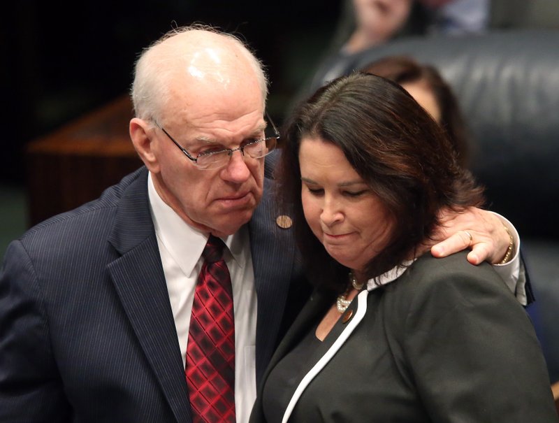 In this March 9, 2016, file photo, Sen. Alan Hays, R-Umatilla, left, congratulates Sen. Kelli Stargel, R-Lakeland, after Stargel's bill to limit abortions in Florida passed the Senate in Tallahassee, Fla. 