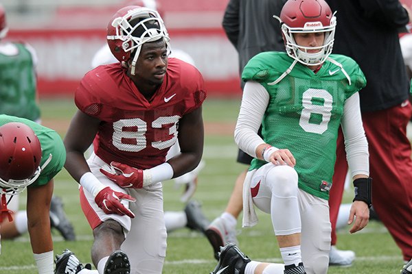 Arkansas tight end Jeremy Sprinkle (83) and quarterback Austin Allen (8) stretch prior to practice Saturday, Aug. 20, 2016, at Razorback Stadium in Fayetteville. 