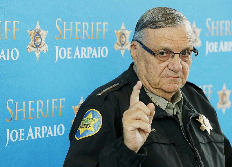 In this Dec. 18, 2013, file photo, Maricopa County Sheriff Joe Arpaio speaks at a news conference at the Sheriff's headquarters in Phoenix. 