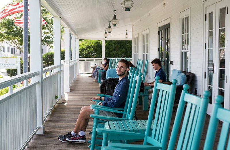 Timofti Flaviu sits on the porch at the Harborview Hotel in Edgartown, Mass., a place the summer worker from Romania found “not like a real town at all. This place has no history.” 