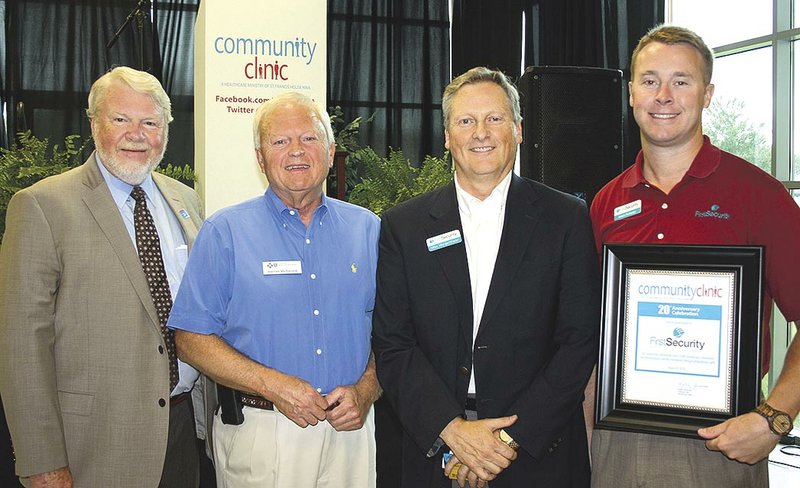 Dan Hawkins, Policy for National Association of Community Health Centers vice president (from left), Warren McDonald, Mike Morgenthaler and Adam Rutledge attend the Community Clinic 20th anniversary breakfast.