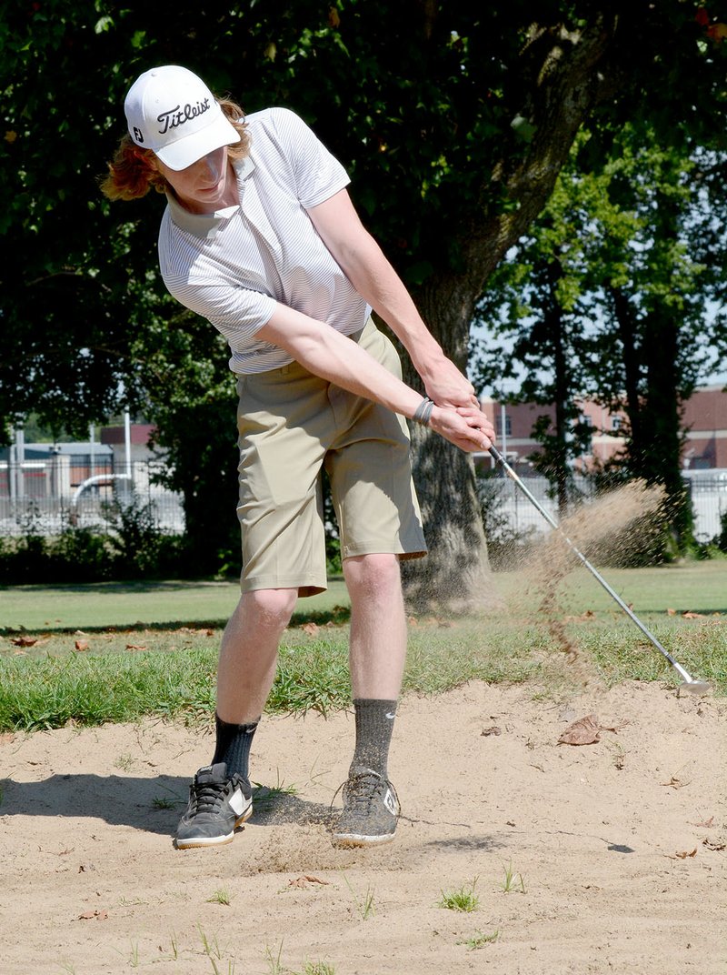 Bud Sullins/Special to Siloam Sunday Siloam Springs senior golfer Solo Jackson chips out of the bunker during Wednesday&#8217;s golf match against Springdale Har-Ber.