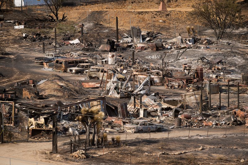 Homes burned by California fire; teams look for more damage