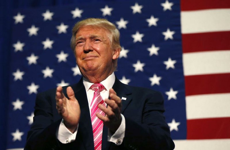 Republican presidential candidate Donald Trump arrives to speak at a campaign rally in Fredericksburg, Va., Saturday, Aug. 20, 2016. 