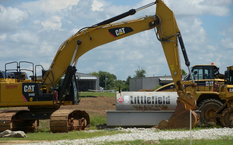 Construction equipment sits on a site Friday on Southwest I Street next to Bentonville Municipal Airport.
