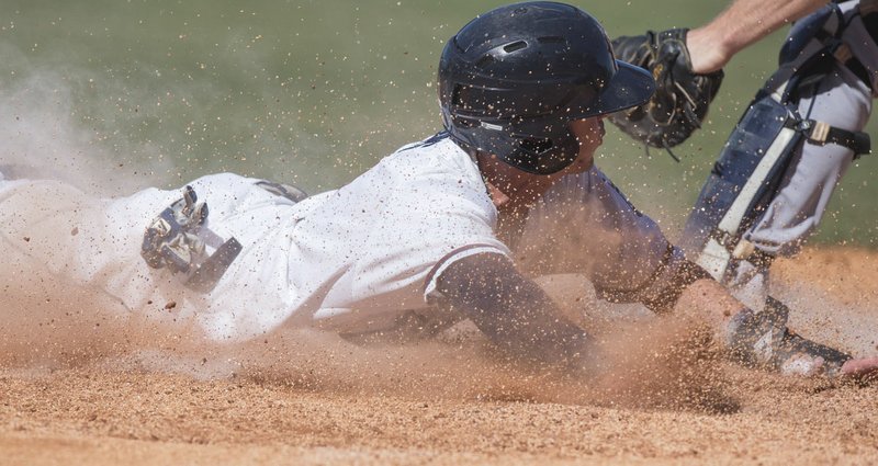 Corey Toups slides into home plate for an eighth inning run during the Naturals' game against San Antonio Sunday Aug. 21, 2016 at Arvest Ballpark in Springdale.