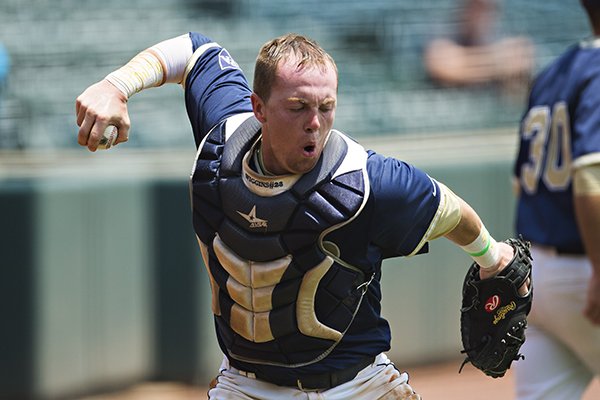 Blake Wiggins of the Pulaski Academy Bruins pumps his fist after catching a foul ball to end the inning against the White Hall Bulldogs during the 2014 5A Boys Baseball Finals at Baum Stadium in Fayetteville.