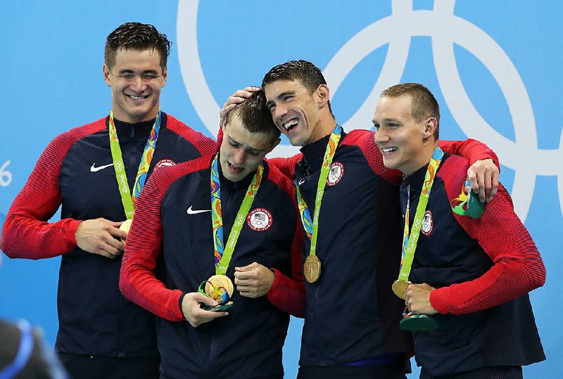 The 2016 Olympics in Rio de Janeiro will be remembered for many moments, including when American swimmer Ryan Held (left) was comforted by teammate Michael Phelps on the medal stand after winning the gold medal in the men’s 400-meter freestyle relay, but the Summer Games will also serve as a reminder that not every country is ready to be a host.