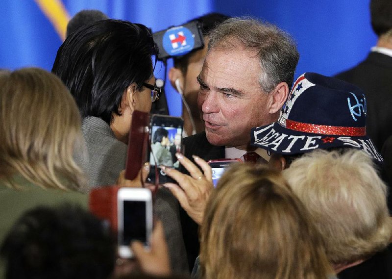 Democratic vice presidential candidate Sen. Tim Kaine of Virginia meets with people after speaking Monday at the Local 525 Plumbers and Pipefi tters Training Center in Las Vegas.
