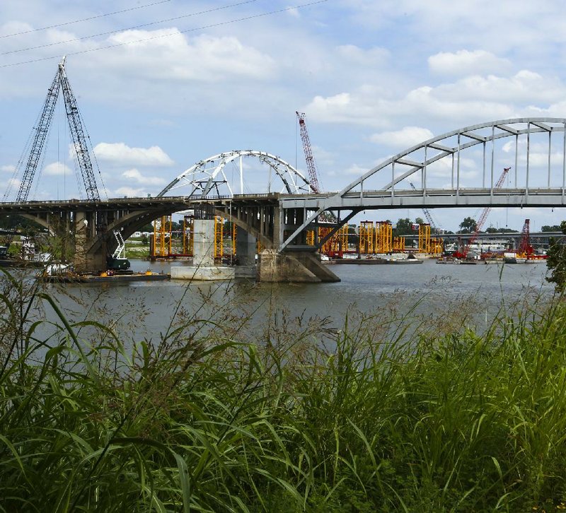 Work on the new Broadway Bridge goes on Monday, Aug. 22, 2016,  a short distance upriver from the old bridge. 