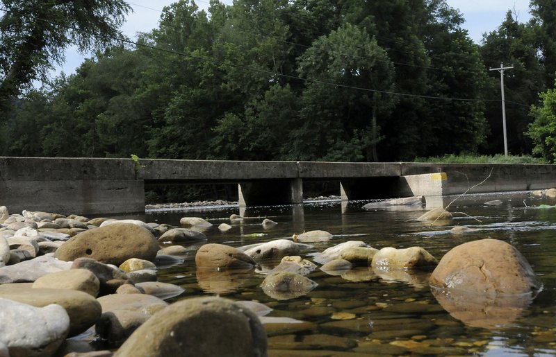 The Buffalo National River at the Ponca low-water bridge is busy with floating activity in higher water, but quiet when the river slows to a trickle during summer.