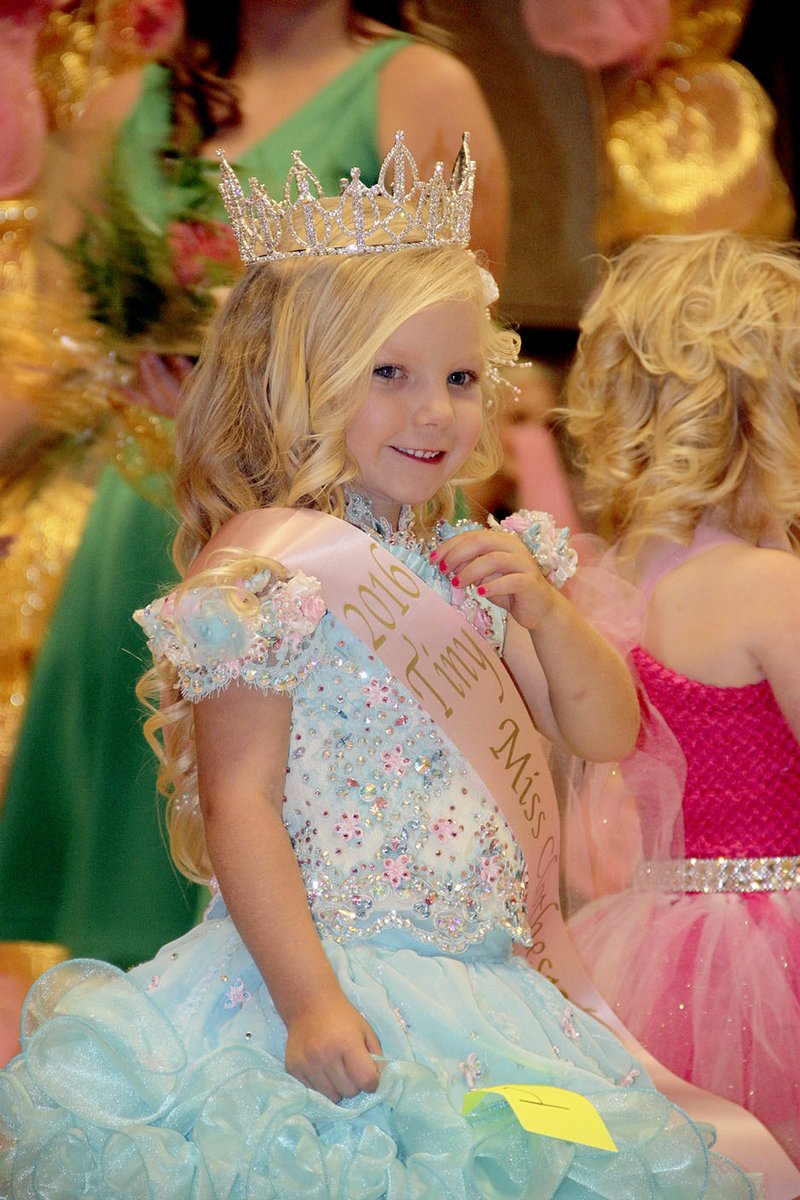 PHOTOS BY LYNN KUTTER ENTERPRISE-LEADER Addison Bailey of Prairie Grove was crowned Tiny Miss Clothespin for girls 3-4 years old. Cali Hartgrave was named Princess and McKinley Jones was named Miss Photogenic.