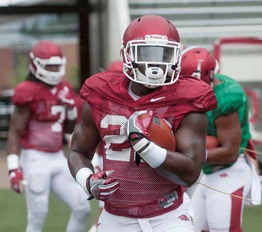 NWA Democrat-Gazette/Michael Woods RAWLEIGH HOG: Arkansas running back Rawleigh Williams III, returning from a broken neck last year, runs drills before the Razorbacks' scrimmage Saturday at Reynolds Razorback Stadium in Fayetteville. The Razorbacks began fall classes Monday, getting into a game-week practice schedule. The Hogs open the season Sept. 3 against Louisiana Tech in Fayetteville.